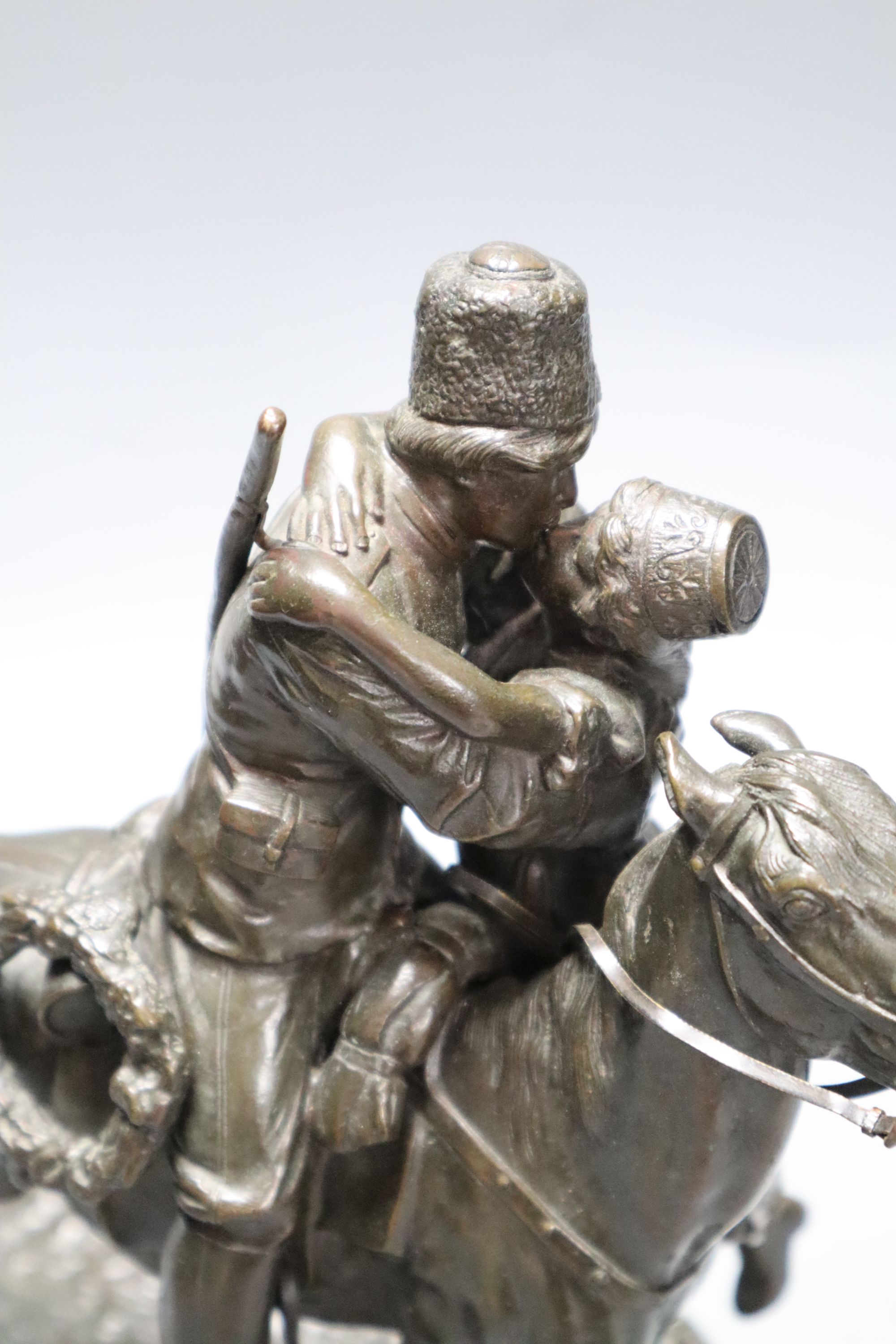 A Russian bronze of a gentleman on horseback kissing his lover, signed, height 25cm